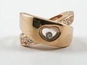 X Shaped Rose Gold Ring With Heart Center Stone
