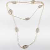 Gold tone oval shape pave cz long brass necklace
